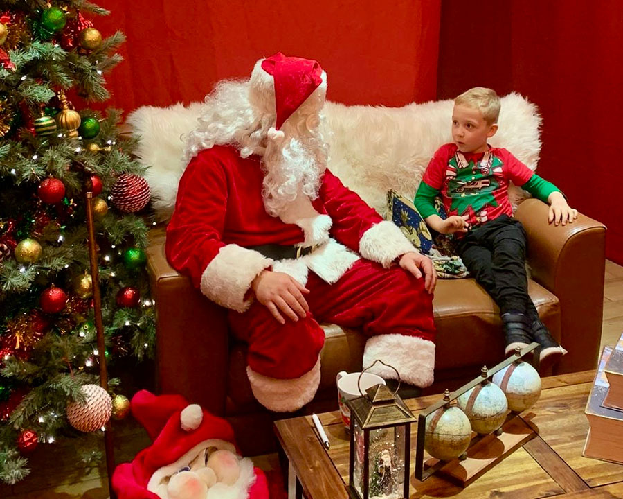 Santa with child in grotto