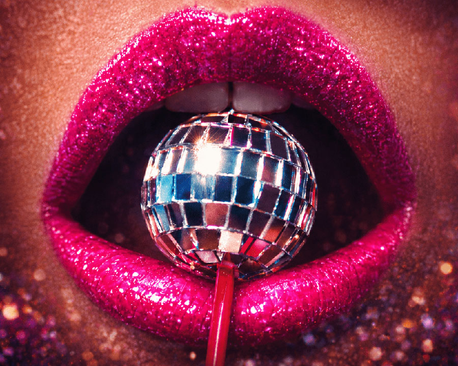Mini disco ball lolly in a sparkly mouth